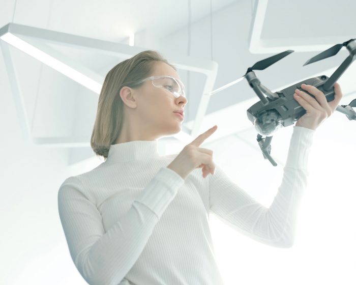 woman-with-modern-drone-G8NRETR.jpg
