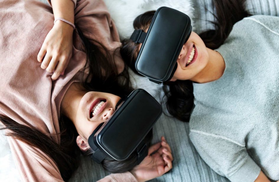 women-experiencing-virtual-reality-with-vr-headset-P8EWPYR.jpg
